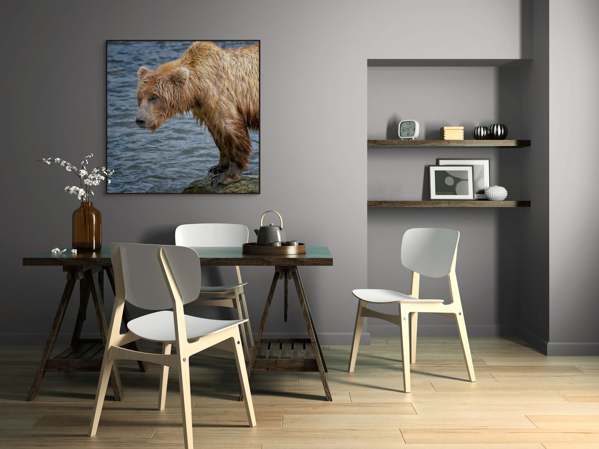 Image of a bear standing on a rock beside the water hanging above a table.