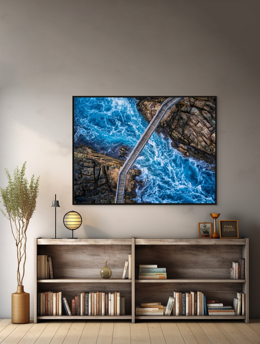 Image of water rushing under bridge over 2 cliffs hanging over bookcase