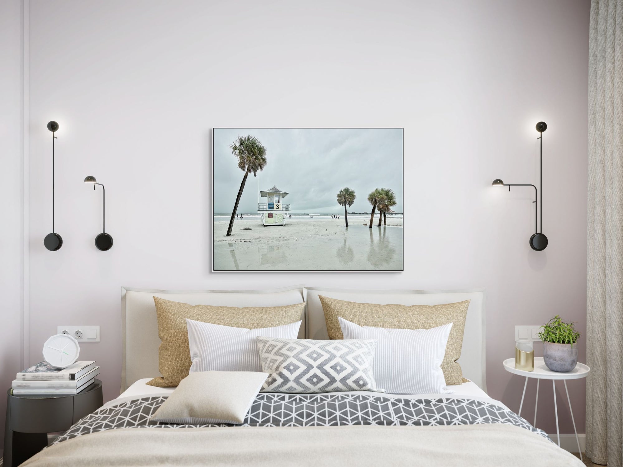 Image of beach with lifeguard stand and palm trees framed over bed.