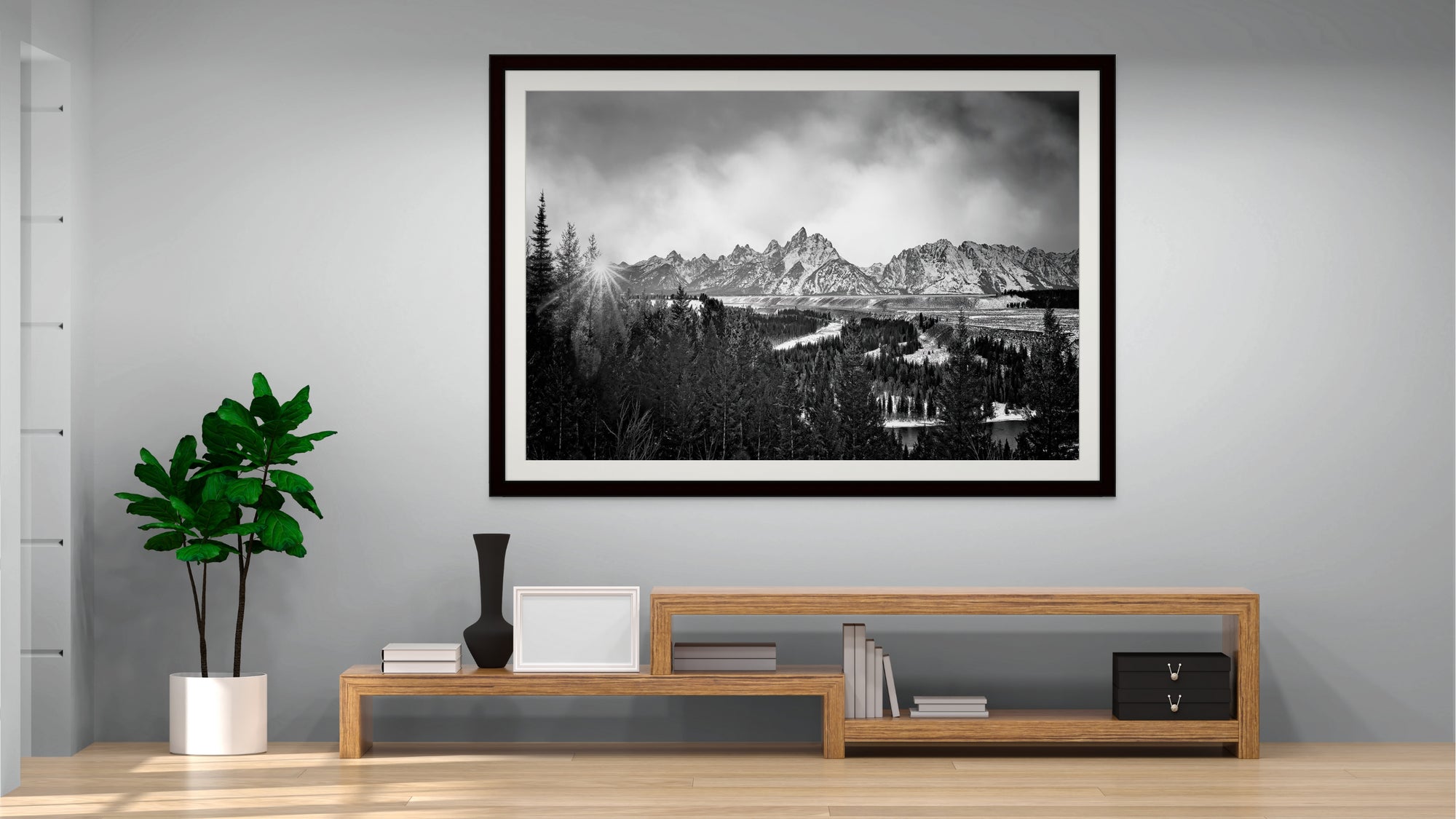 image of black and white mountains hanging above table