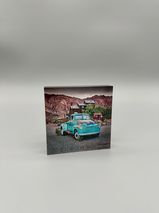 Print with a vintage truck in a desert landscape