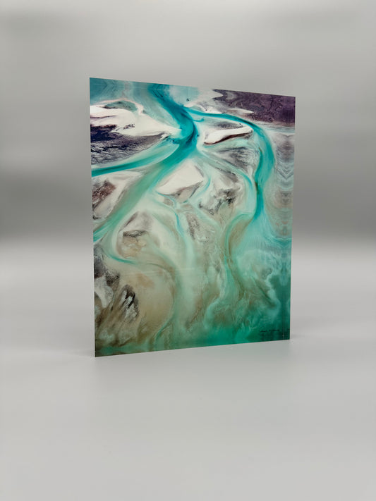Art print with swirling green and brown patterns on a gray background