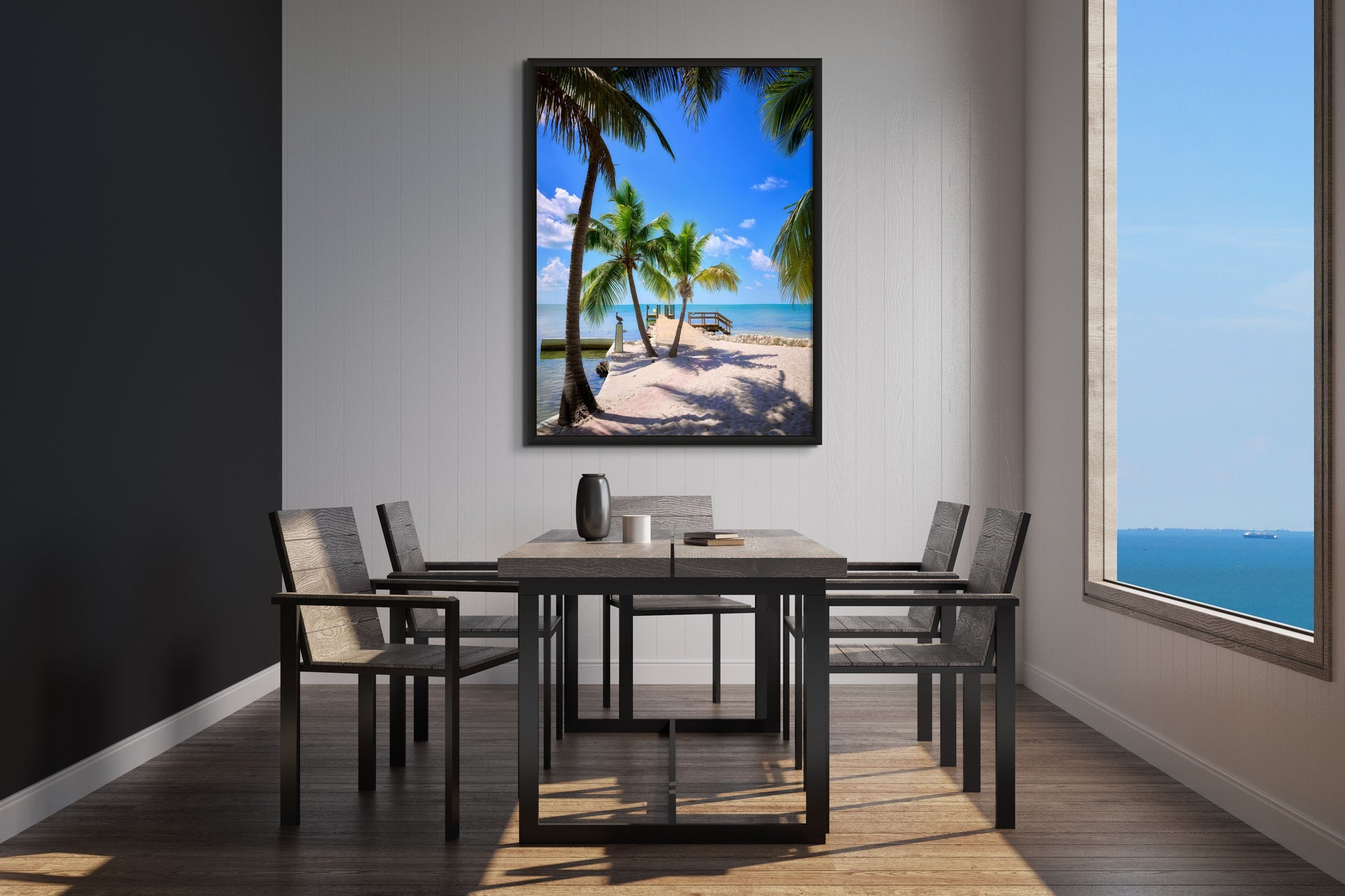 Image of palm trees and water framed over dining table