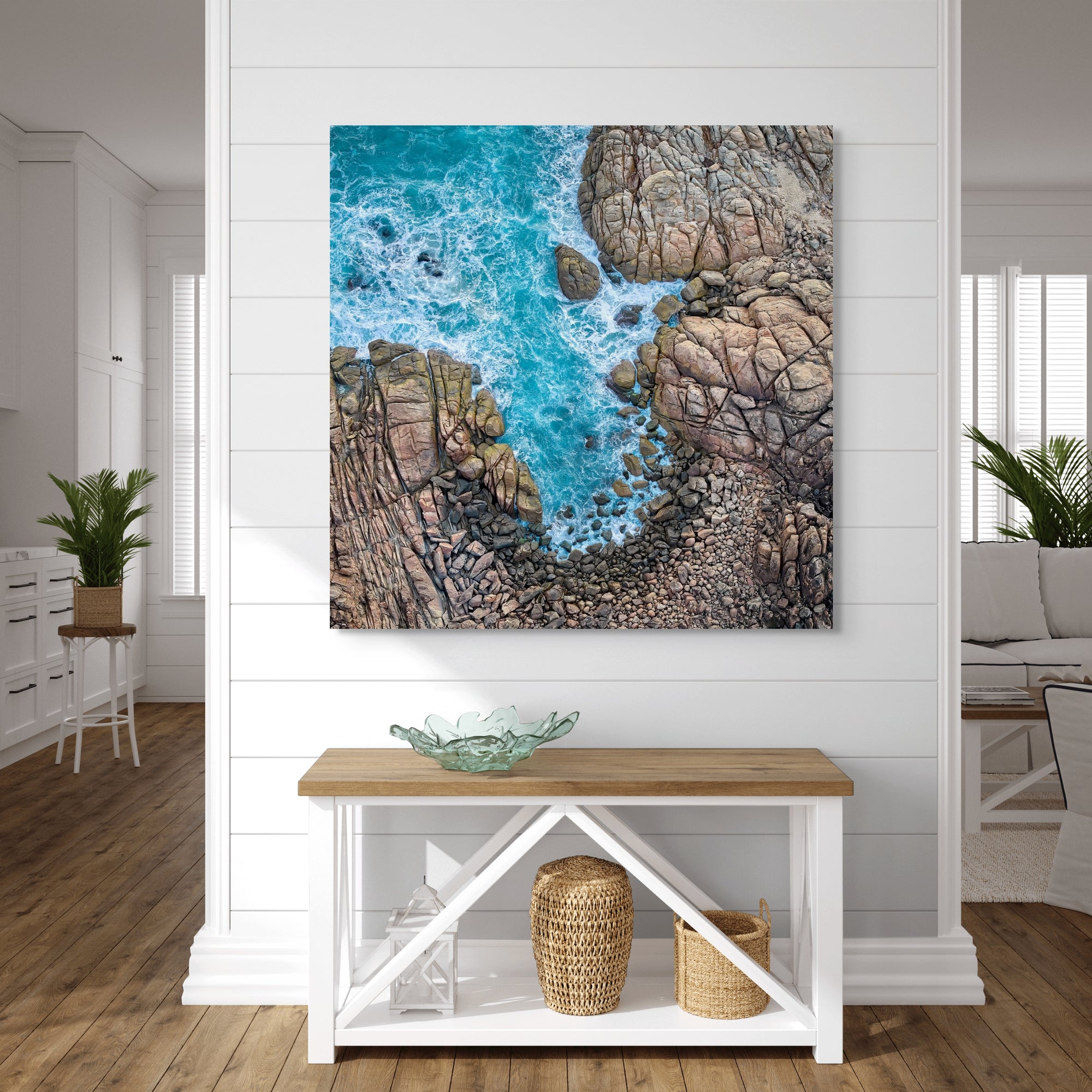 Image of Rocks and water shot from above in Australia above a console table.