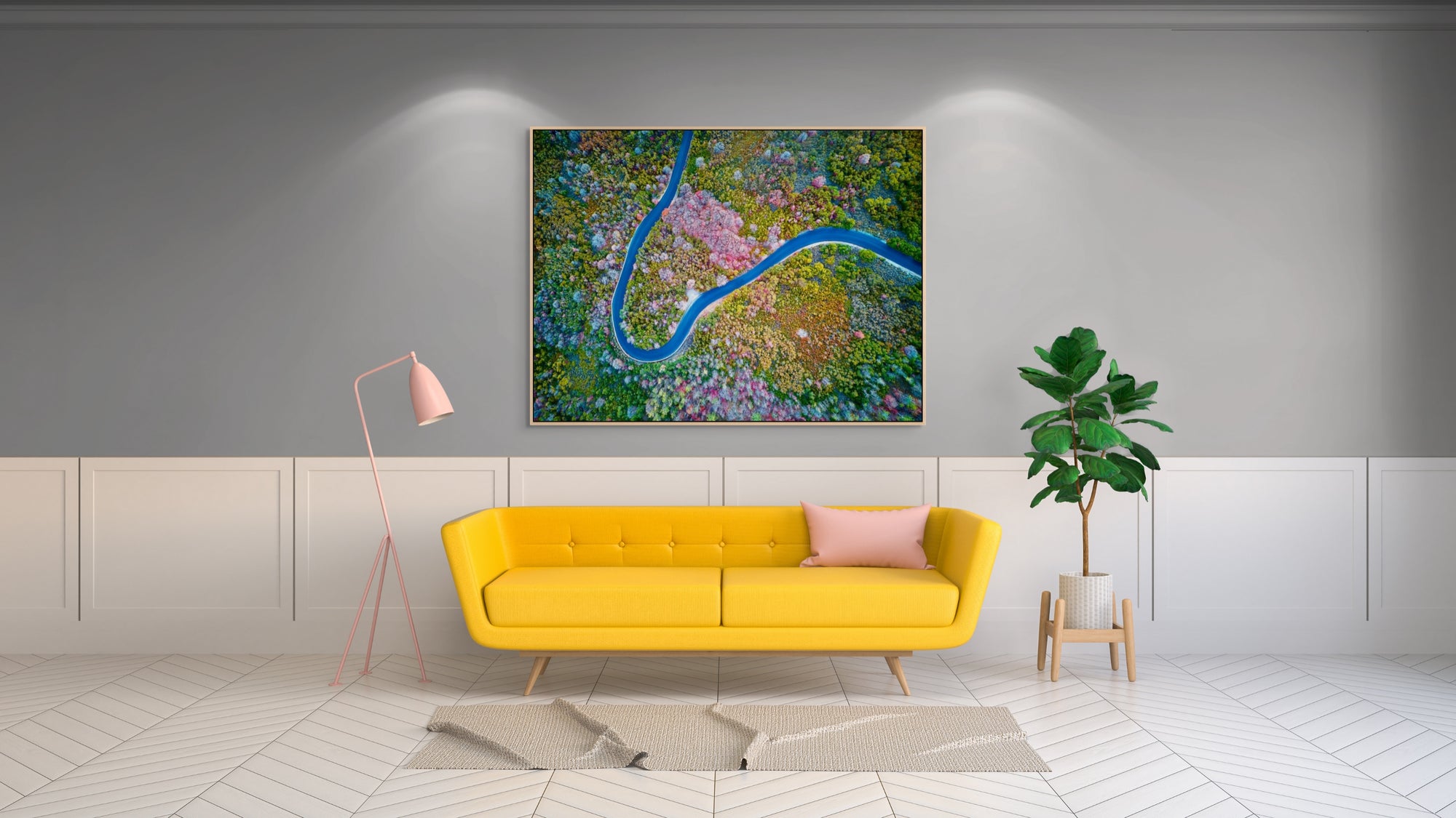 Image of a mountain road switchback photographed from above framed above a sofa.
