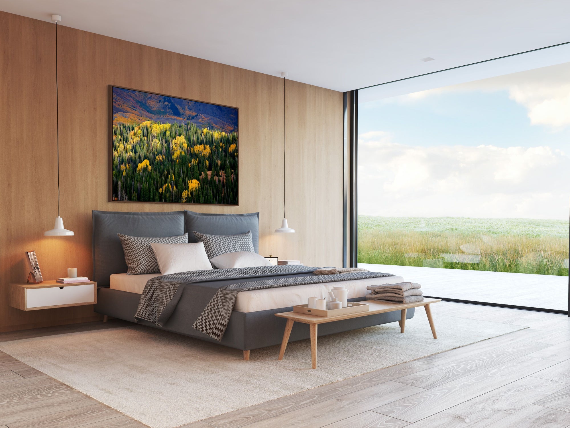 Aerial image looking down on Aspen trees and the Utah Mountains framed over a bed.