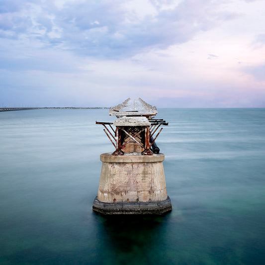 Image of abandoned pier in middle of the ocean.