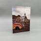 Rustic scene with an old car and a small church