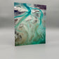 Art print with swirling green and brown patterns on a gray background