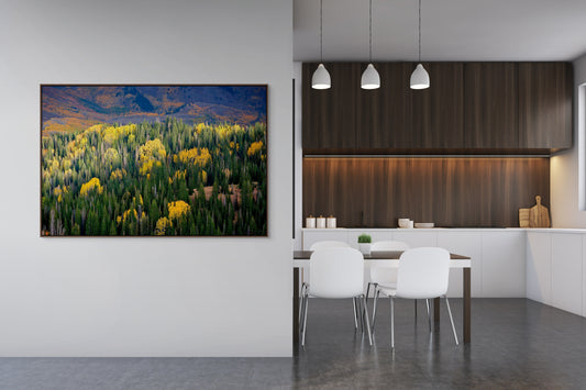 Aerial image looking down on Aspen trees and the Utah Mountains framed in a kitchen.