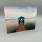 Acrylic resin block with a lake house on the water